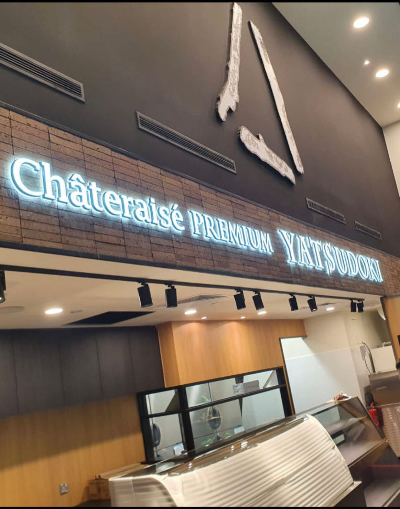 Combination front and back-lit channel letters for Chateraise storefront