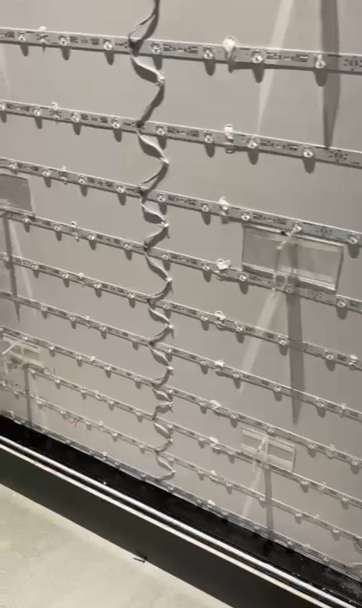 Interior view of lightbox showing LED strip arrangement and diffuser panel
